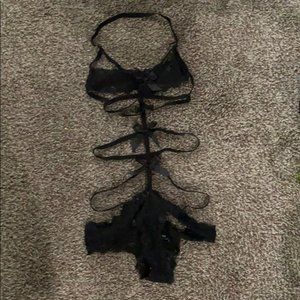 One piece black lace w/bows up front of body!